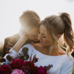 Loving embrace between husband and wife during golden hour